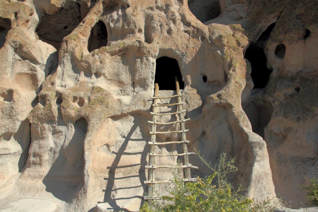 Cavates (small human-carved alcoves) in the rocks that can be accessed via wooden ladders in Bandelier National Monument.