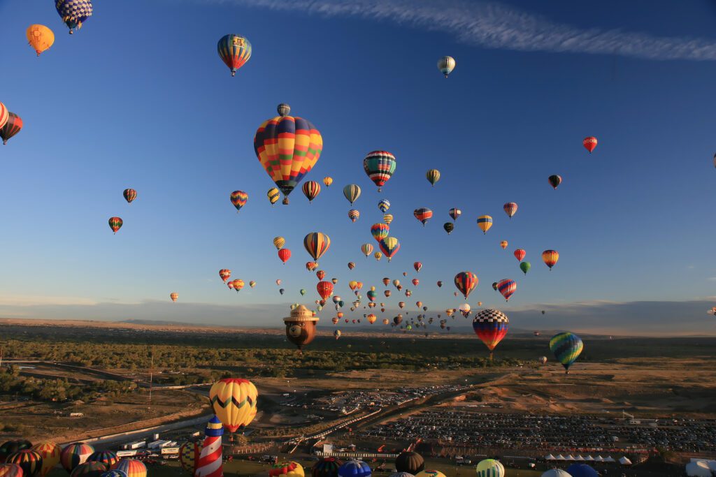 Hundreds of hot-air balloons takeoff each morning and land around various parts of Albuquerque, New Mexico just in time to pack them up and go to brunch.