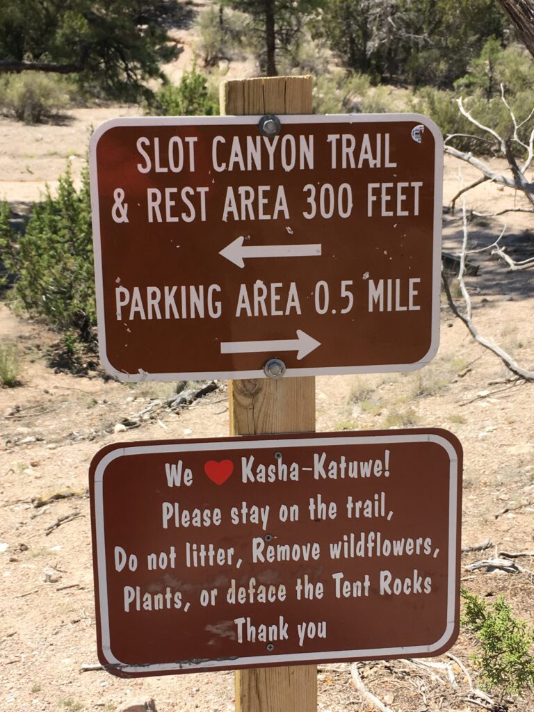 Slot Canyon parking and trail sign at the beginning of The Canyon Trail in Kasha-Katuwe Tent Rocks area.