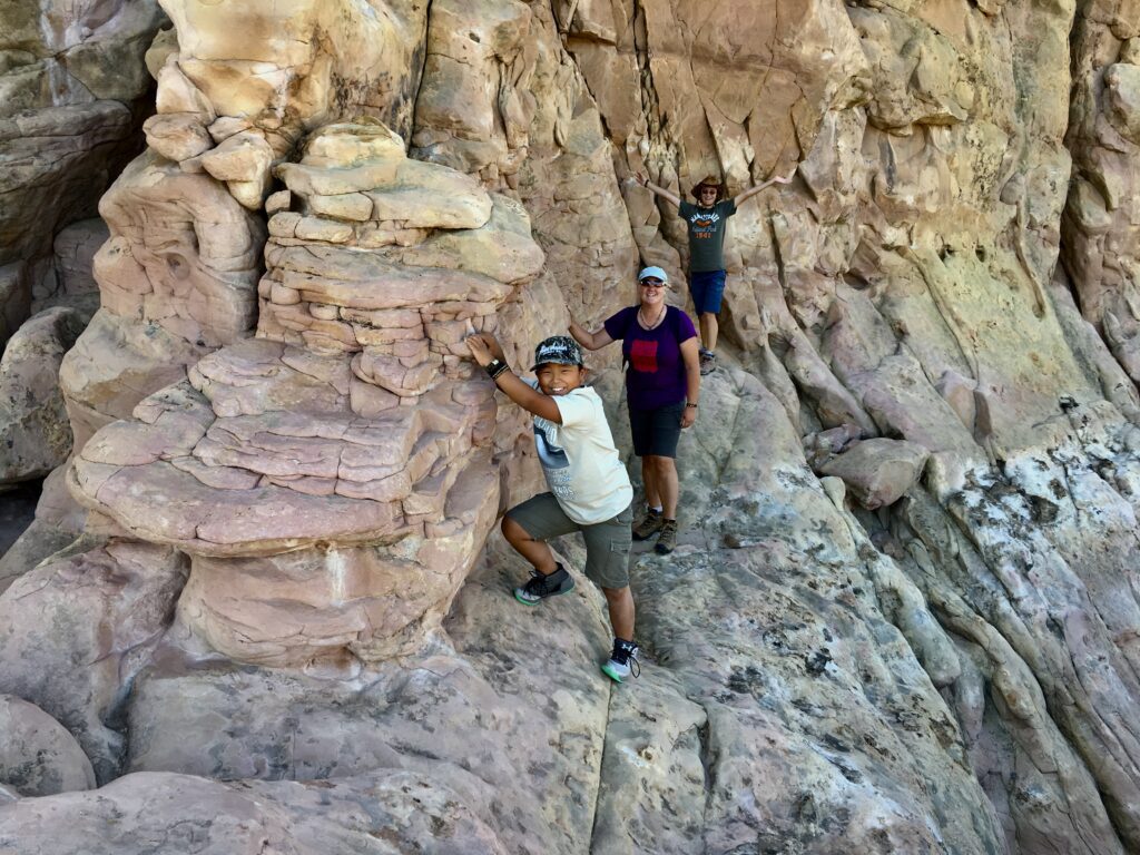 The author's family posing on one of the many sandstone cliffs in El Maipais National Monument, New Mexico.