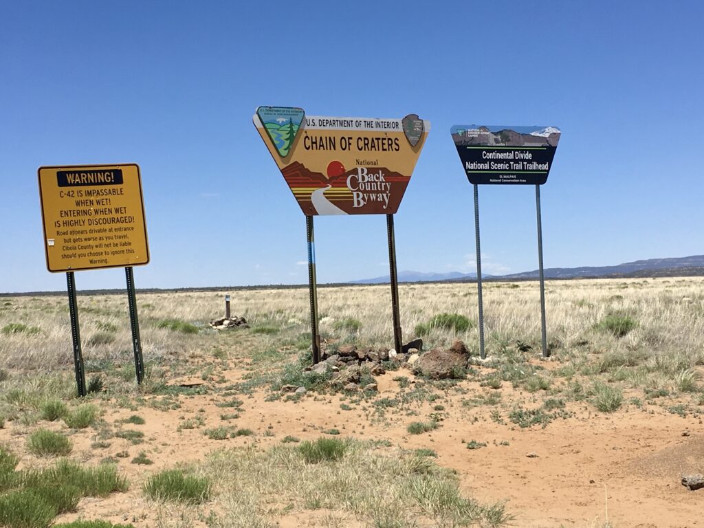 Signs at the entrance to County Road 42 (a.k.a. Chain of Craters National Back Country Byway).