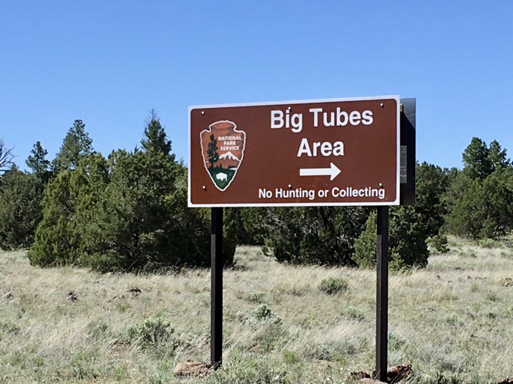 Road sign pointing to the Big Tubes Area of El Maipais National Monument, New Mexico.