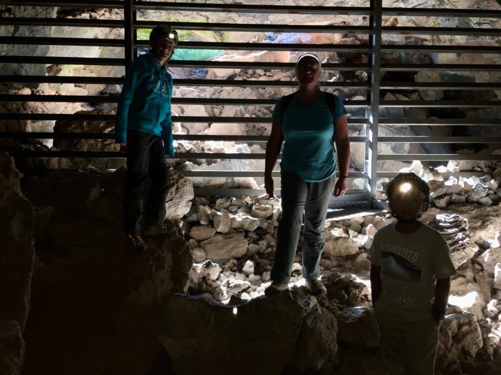 The author's family at the entrance to the small lava tube in El Maipais National Monument, New Mexico.