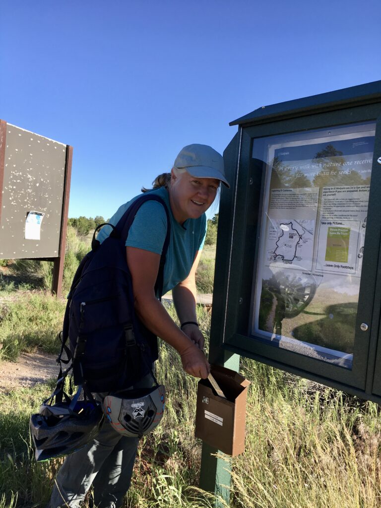 Returning our free lava tube cave pass at the drop box in El Maipais National Monument, New Mexico.